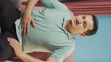 Vertical-video-of-Man-with-stomachache.